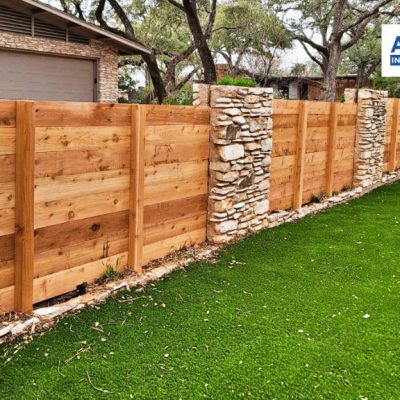 wooden fence with stone posts